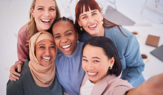Diverse group of women take a selfie photo